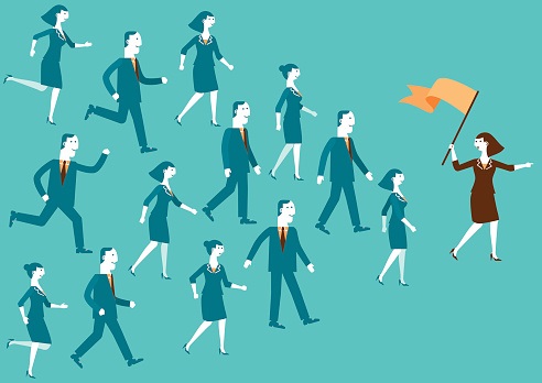 An illustrated group of people eagerly following a leader in the front holding a flag and pointing forward