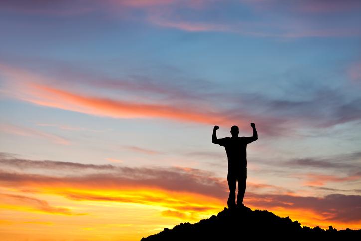 Silhouette of a Strong Man With Biceps Pumped