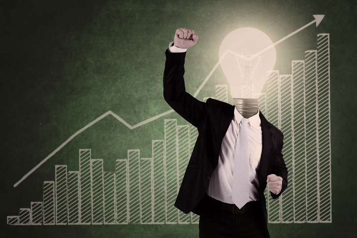 Successful businessman with profit bar chart