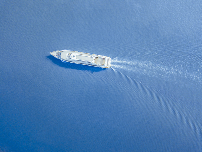 ship ferry in the city river aerial shot