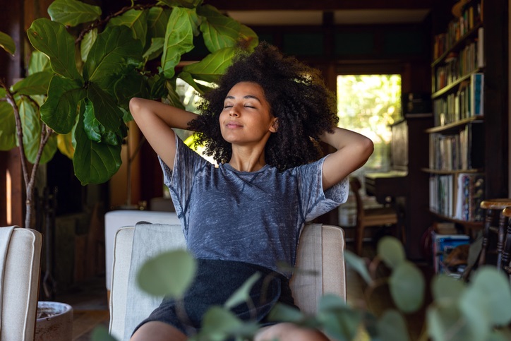 Photo of a women relaxing in a chair looking content