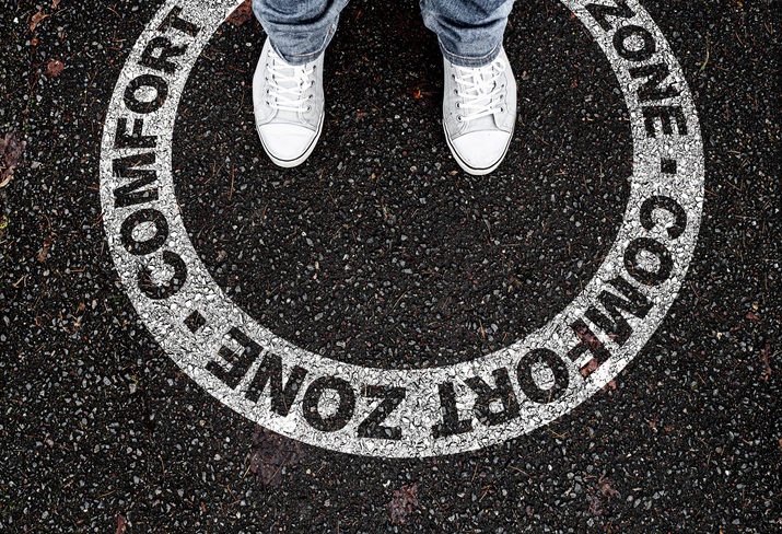 A person standing within a circle labeled "comfort zone"