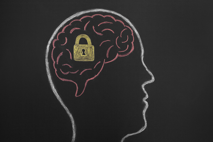 A side profile silhouette drawing of a human head with the brain drawn in pink. There is a gold lock inside the brain with a hole for a key